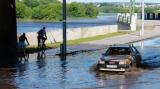 Car in the middle of the sudden flood